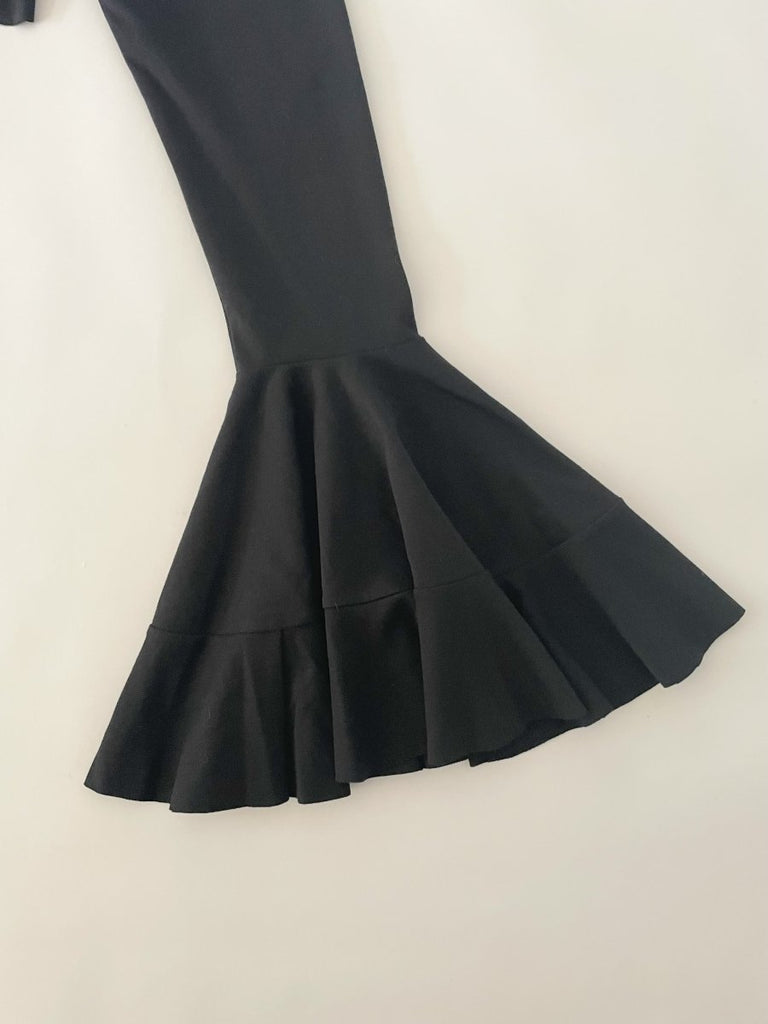 Handmade black asymmetrical ruffle leggings, size XS, with two gold metal closures at the back, crafted from synthetic double-knit by Sarah Aphrodite.