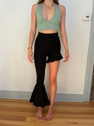 Handmade black asymmetrical ruffle leggings, size XS, with two gold metal closures at the back, crafted from synthetic double-knit by Sarah Aphrodite.