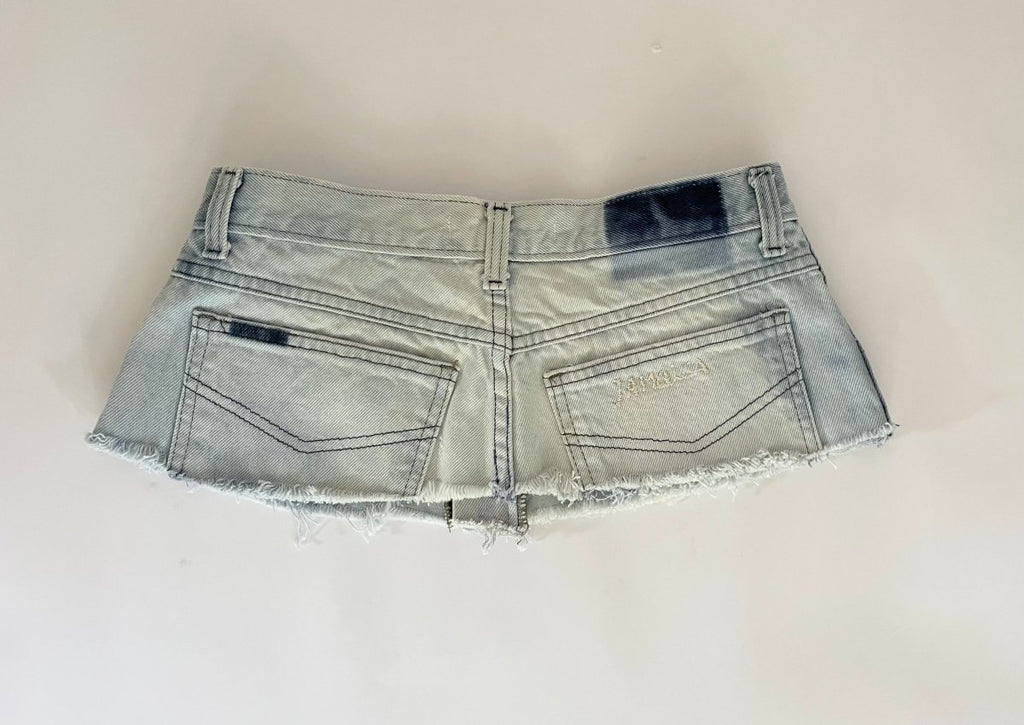 Repurposed denim belt with raw edge, zipper closure, and "Jamaica" embroidery. A one-of-a-kind Sarah Aphrodite piece from archival denim.