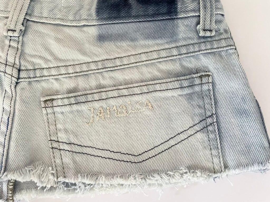 Repurposed denim belt with raw edge, zipper closure, and "Jamaica" embroidery. A one-of-a-kind Sarah Aphrodite piece from archival denim.