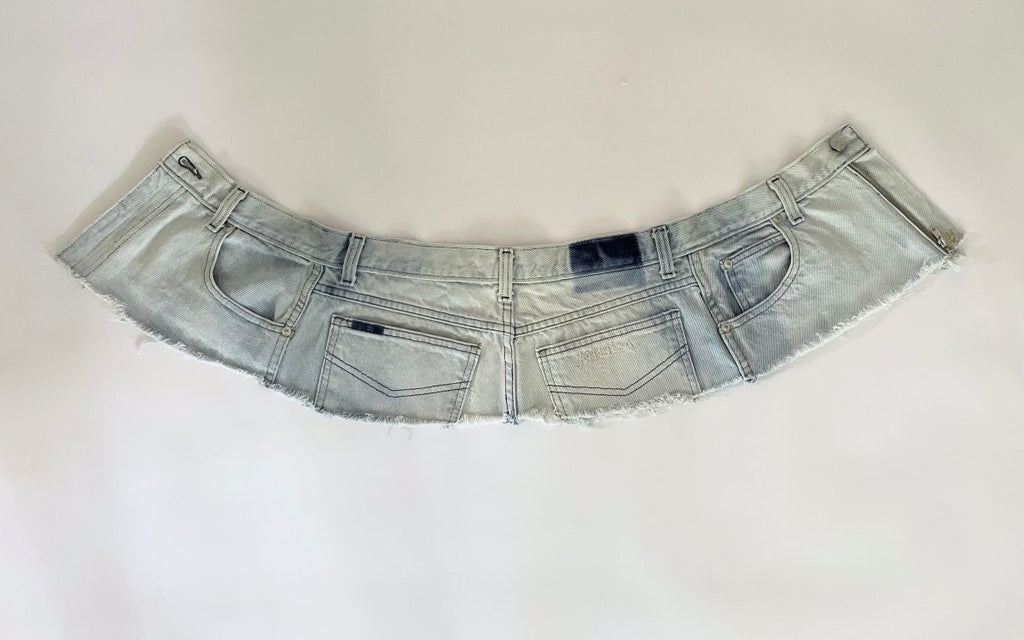 Repurposed denim belt with raw edge, zipper closure, and "Jamaica" embroidery. A one-of-a-kind Sarah Aphrodite piece from archival denim.