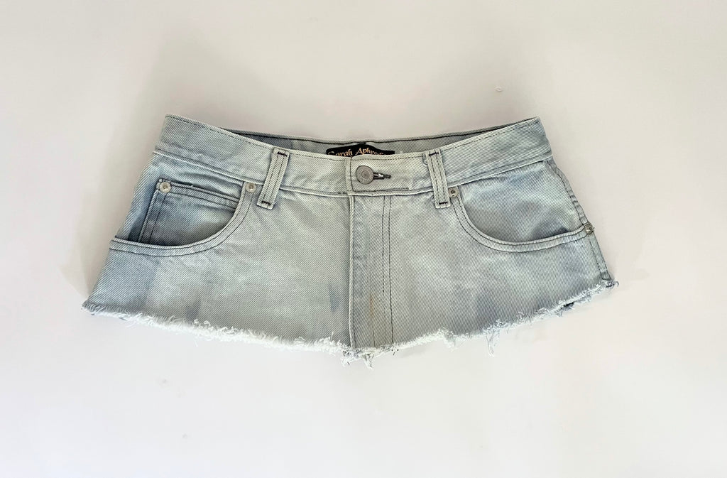 Repurposed denim belt with raw edge, zipper closure, and "Jamaica" embroidery. A one-of-a-kind Sarah Aphrodite piece from archival denim.