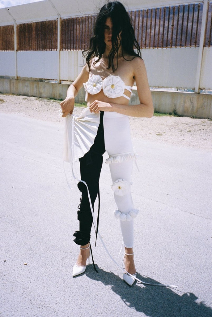 One-of-a-kind handmade high-waisted black and white leggings by Sarah Aphrodite, crafted from sustainable deadstock and gifted jersey fabrics, designed for comfort and expressive eco-conscious style.