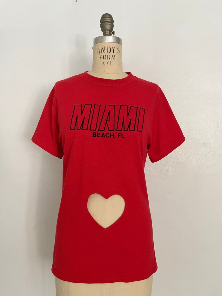 Red repurposed T-shirt with heart cut-out and Miami Beach FL embroidery, displayed on mannequin.