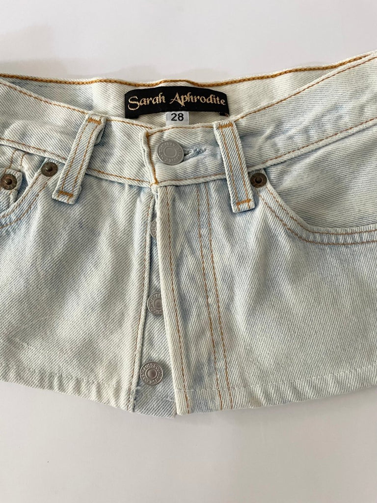Handmade one-of-a-kind bleached denim belt by Sarah Aphrodite, size 28" waist, 7.5" wide, with hand-bleached finish, subtle painted flower mark, and original label detail on back.