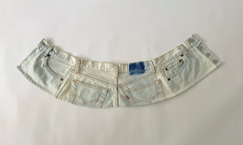 Handmade one-of-a-kind bleached denim belt by Sarah Aphrodite, size 28" waist, 7.5" wide, with hand-bleached finish, subtle painted flower mark, and original label detail on back.