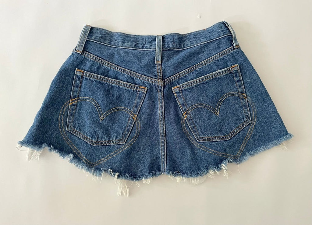 Handmade one-of-a-kind repurposed denim belt by Sarah Aphrodite, size 25" waist, fully opens with original button closure, frayed edges, high-waisted design.