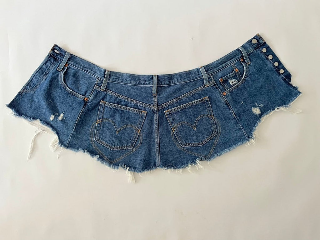 Handmade one-of-a-kind repurposed denim belt by Sarah Aphrodite, size 25" waist, fully opens with original button closure, frayed edges, high-waisted design.