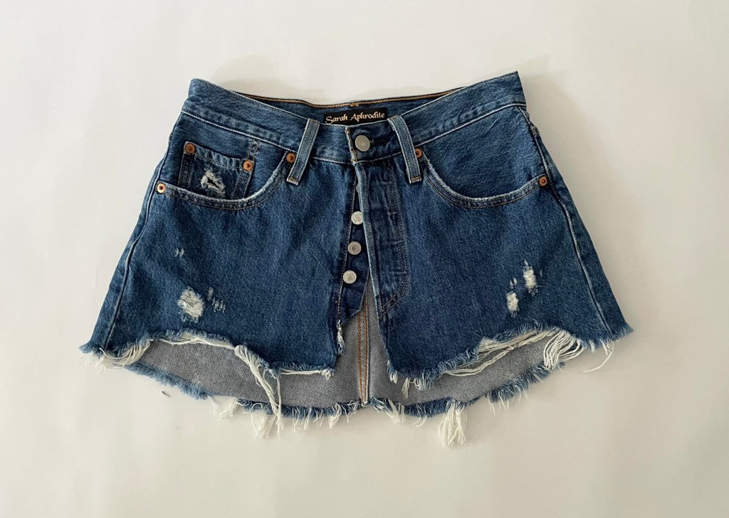 Handmade one-of-a-kind repurposed denim belt by Sarah Aphrodite, size 25" waist, fully opens with original button closure, frayed edges, high-waisted design.