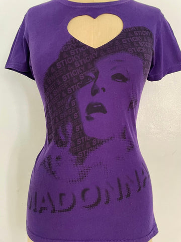 A purple t-shirt with a heart cut-out design and a printed image of a woman's face in the center.
