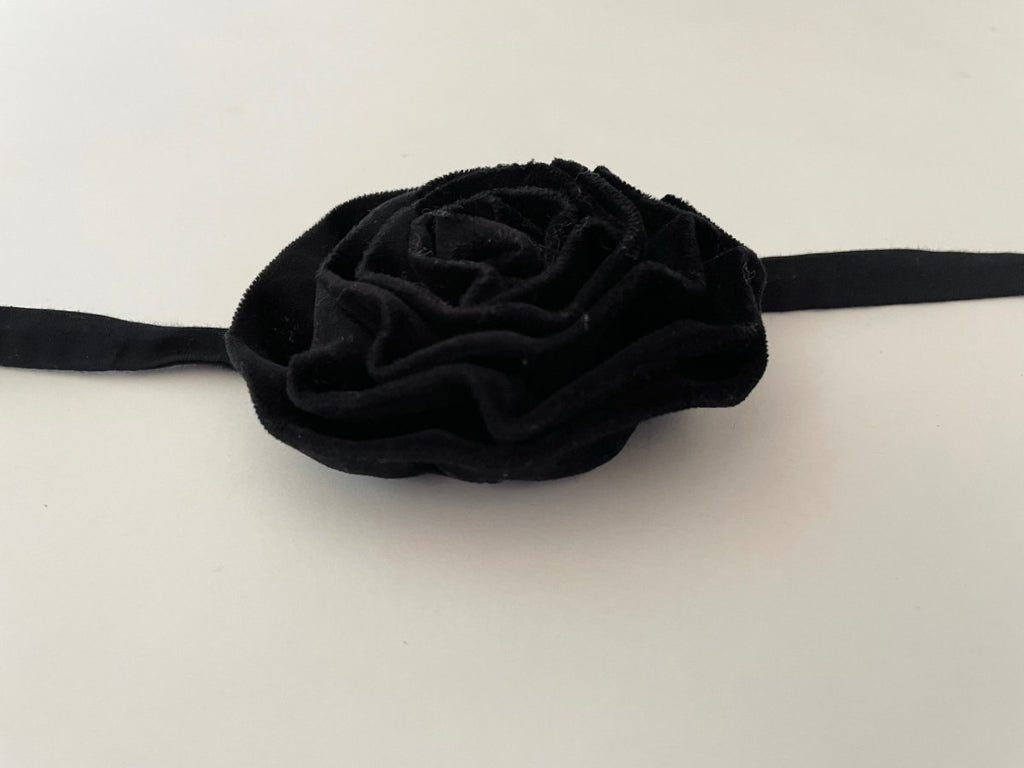 One-of-a-kind black velvet flower accessory by Sarah Aphrodite, handmade from upcycled fabric scraps. Versatile design with ties, worn as choker, bracelet, anklet, upper arm, or garment embellishment.
