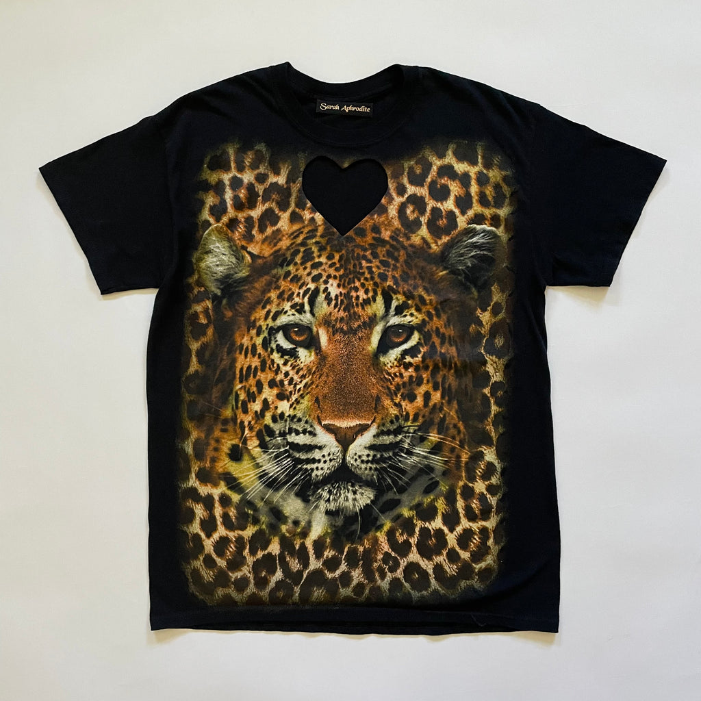 Black T-shirt with heart cut out on the chest and a large leopard print on the front