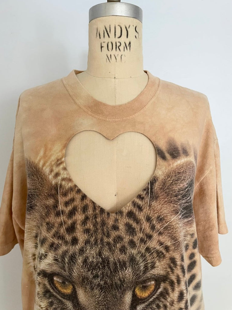 Handmade upcycled cotton leopard T-shirt with bold heart cut-out by Sarah Aphrodite, one-of-a-kind sustainable fashion piece with raw worn-in texture