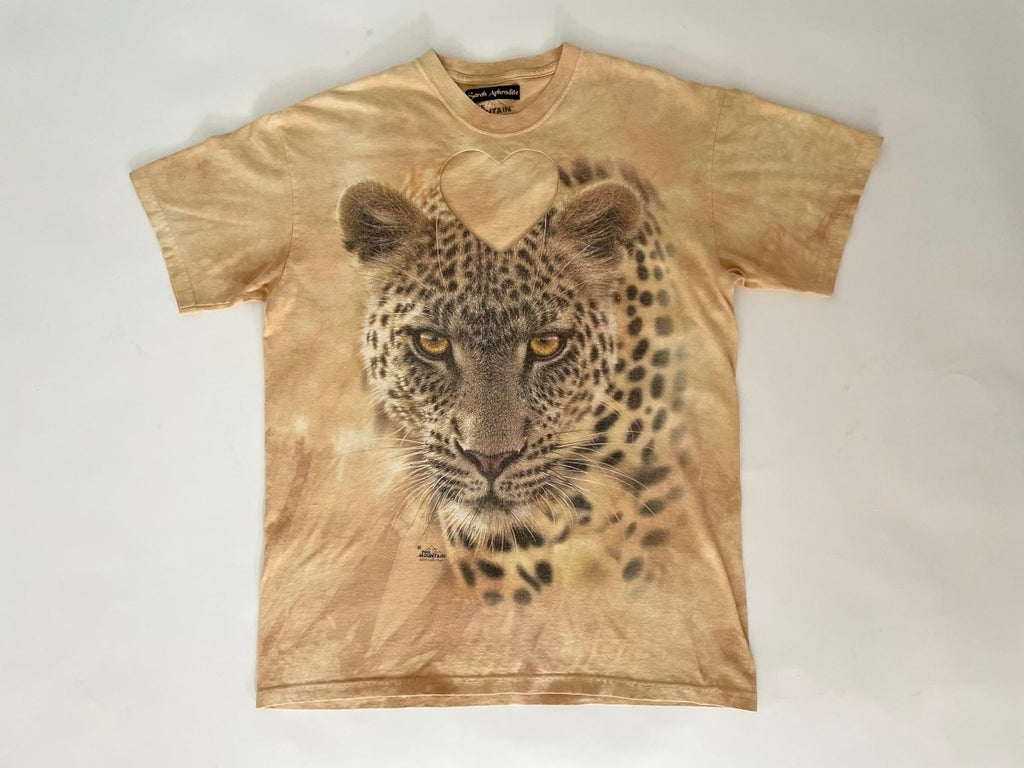 Handmade upcycled cotton leopard T-shirt with bold heart cut-out by Sarah Aphrodite, one-of-a-kind sustainable fashion piece with raw worn-in texture