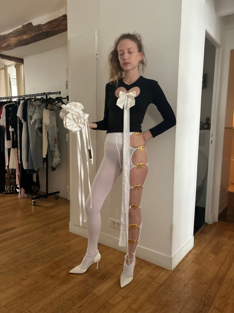 One-of-a-kind handmade flower accessory by Sarah Aphrodite. Upcycled white cotton and silk with long ties. Wear as bracelet, belt, or shoulder piece.