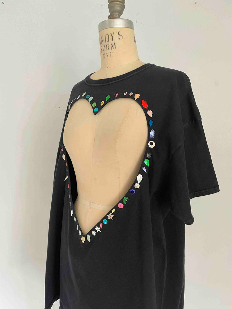 One-of-a-kind black upcycled cotton T-shirt with large heart cut-out and handsewn assorted sequins by Sarah Aphrodite, oversized XL fit