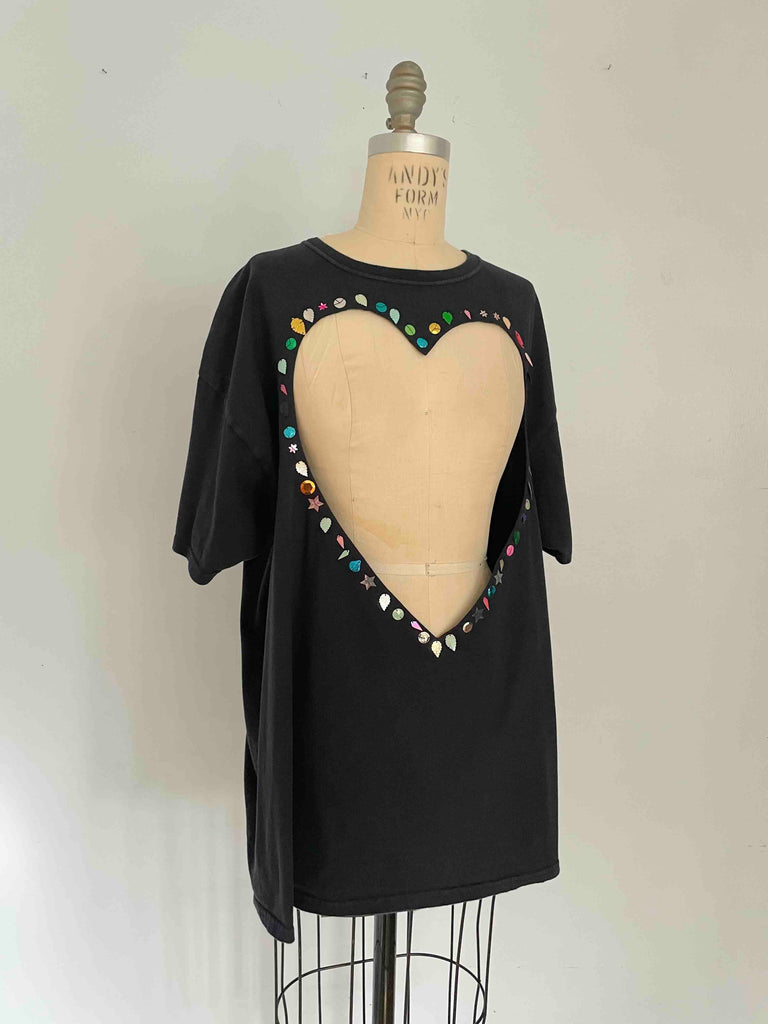 One-of-a-kind black upcycled cotton T-shirt with large heart cut-out and handsewn assorted sequins by Sarah Aphrodite, oversized XL fit