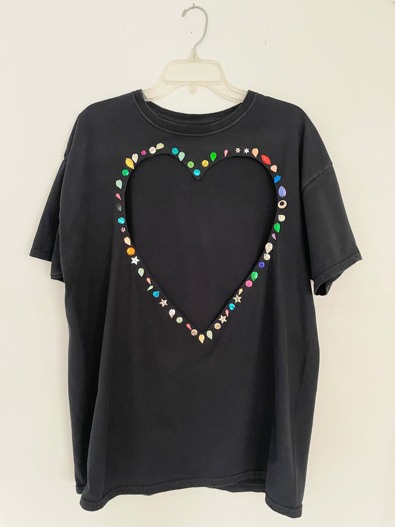 One-of-a-kind black upcycled cotton T-shirt with large heart cut-out and handsewn assorted sequins by Sarah Aphrodite, oversized XL fit