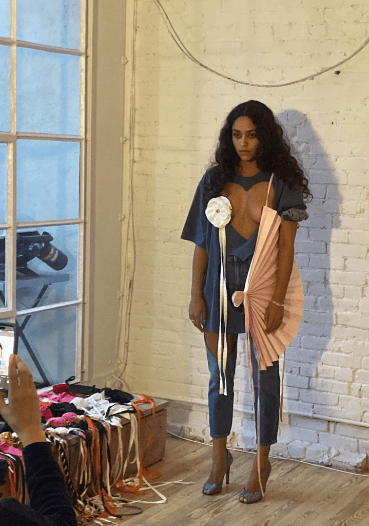 One-of-a-kind repurposed denim-blue double heart cut-out tee by Sarah Aphrodite, hand-sewn from a vintage t-shirt. Large heart openings for layering, soft washed fabric, one size fits all.