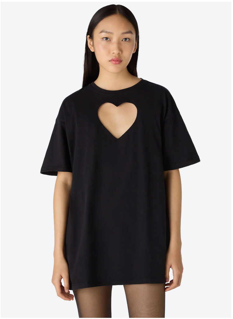 A model wearing a one of a kind oversized upcycled black t-shirt with a large heart-shaped cut-out at the front made by Sarah Aphrodite. 