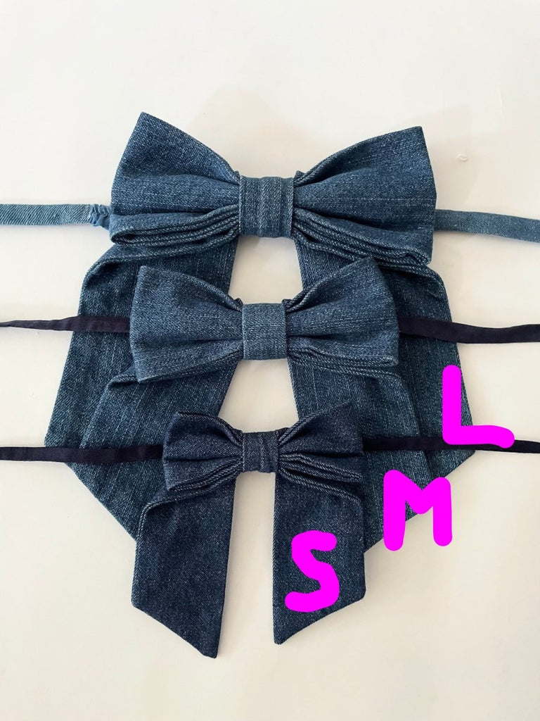 Handmade one-of-a-kind dark blue denim bow garter by Sarah Aphrodite, made from repurposed denim scraps, with long ties for versatile styling on arm, thigh, or waist.