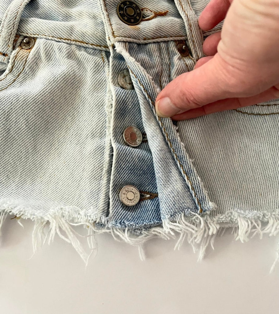 Recycled bleached denim belt , frayed edge, rustic hardware, and original button up closure-size 28 waist

