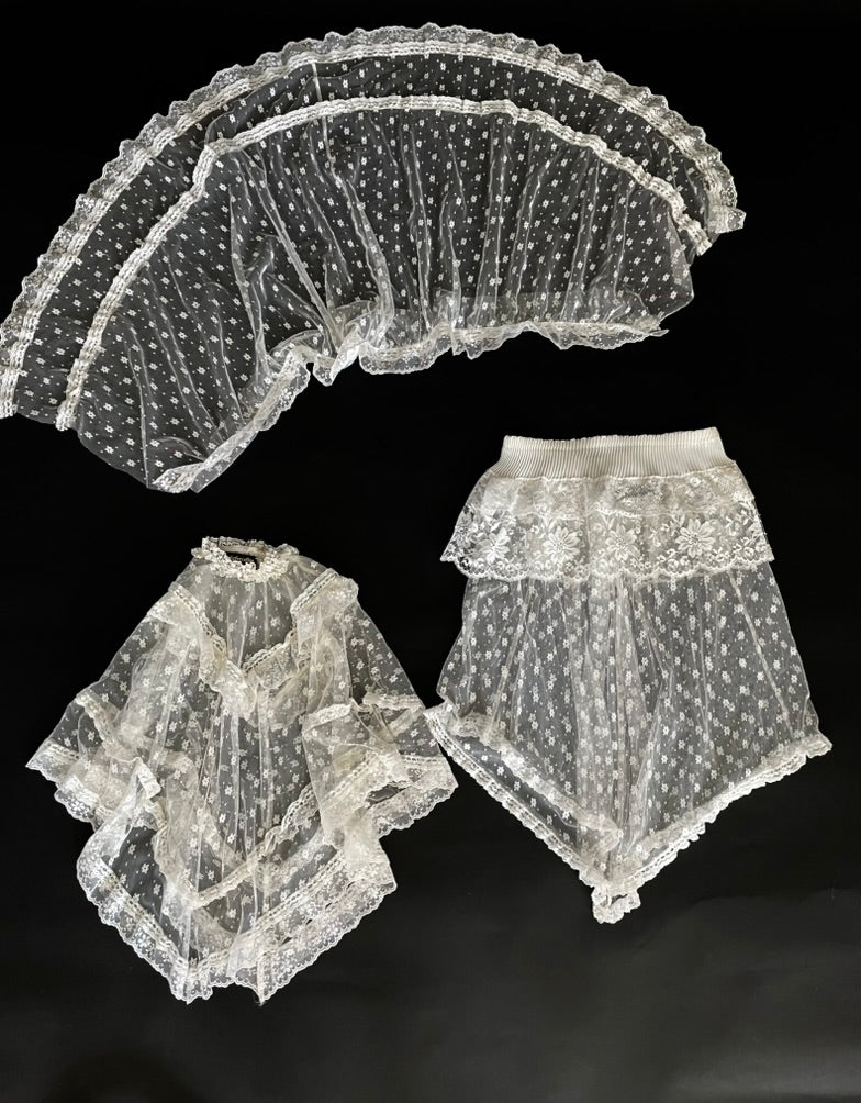 Set of lace accessories on a black background