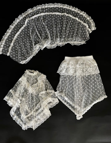 Set of lace accessories on a black background