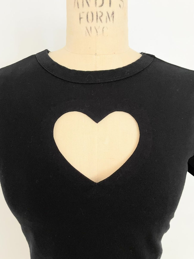 One-of-a-kind sustainable black cropped heart cut-out top by Sarah Aphrodite. Handmade from repurposed stretchy cotton-blend. Fits XS–S.