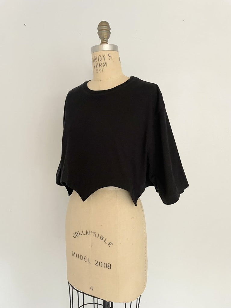 Handmade black cropped T-shirt with scallop hem, crafted from salvaged cotton. One-of-a-kind sustainable piece by Sarah Aphrodite.