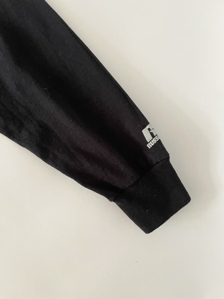 Handmade sustainable black long sleeve top with chest heart cut-out and Russell Athletic logo on sleeve. One-of-a-kind by Sarah Aphrodite. Size Medium.