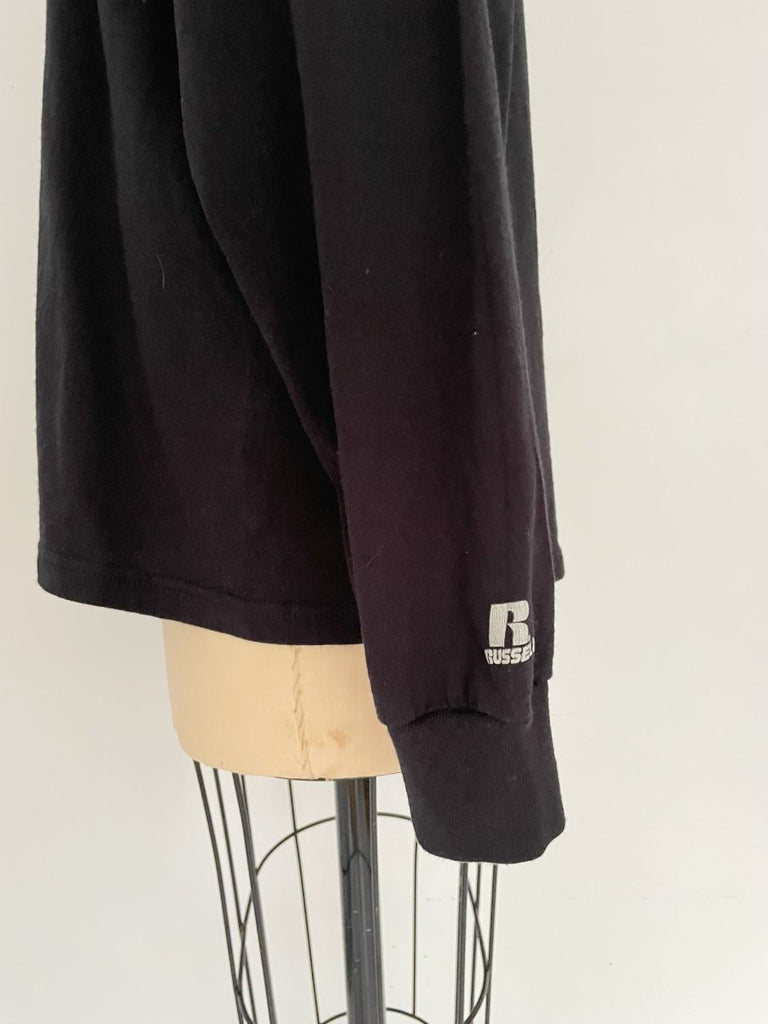 Handmade sustainable black long sleeve top with chest heart cut-out and Russell Athletic logo on sleeve. One-of-a-kind by Sarah Aphrodite. Size Medium.