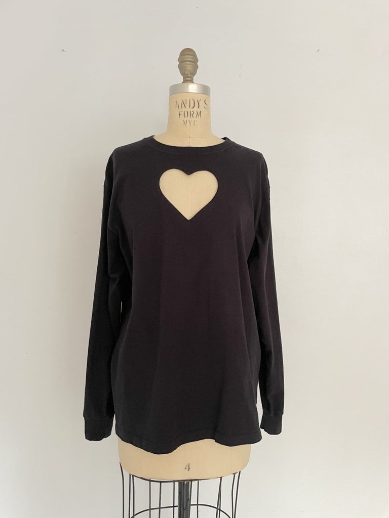 Handmade sustainable black long sleeve top with chest heart cut-out and Russell Athletic logo on sleeve. One-of-a-kind by Sarah Aphrodite. Size Medium.