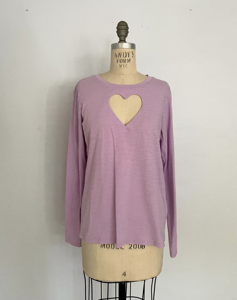 One-of-a-kind sustainable lavender long sleeve top by Sarah Aphrodite. Handmade from repurposed fabric, featuring heart cut-out detail. Fits Small–Medium.