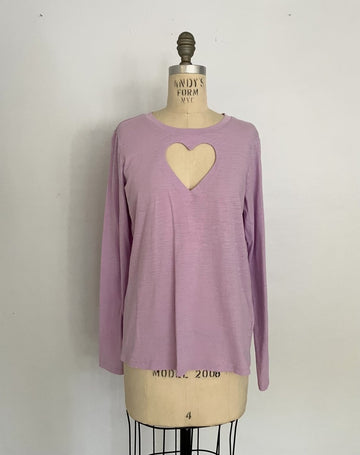 One-of-a-kind sustainable lavender long sleeve top by Sarah Aphrodite. Handmade from repurposed fabric, featuring heart cut-out detail. Fits Small–Medium.