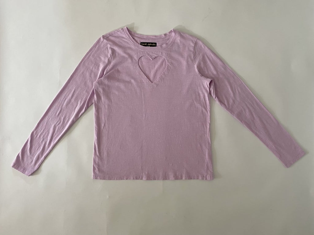 One-of-a-kind sustainable lavender long sleeve top by Sarah Aphrodite. Handmade from repurposed fabric, featuring heart cut-out detail. Fits Small–Medium.