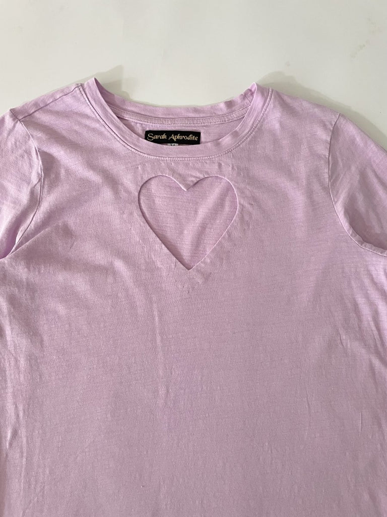 One-of-a-kind sustainable lavender long sleeve top by Sarah Aphrodite. Handmade from repurposed fabric, featuring heart cut-out detail. Fits Small–Medium.