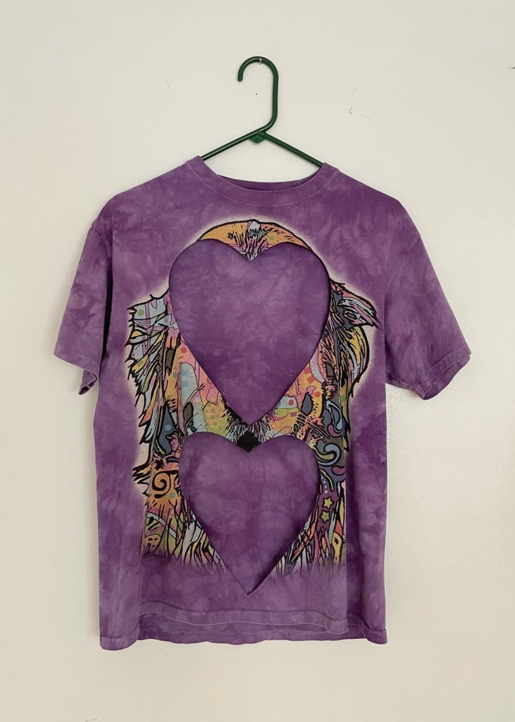 Sustainable handmade purple upcycled cotton T-shirt with faint print details and two large heart cut-outs by Sarah Aphrodite, size large fits XS–L