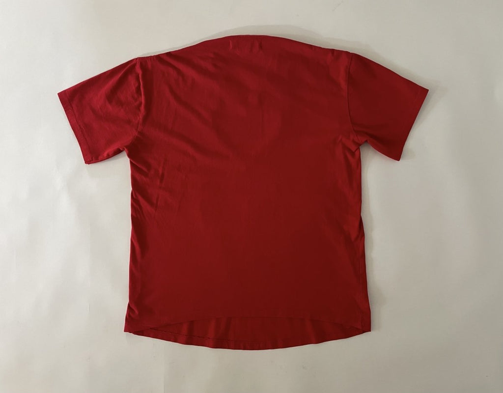 One-of-a-kind sustainable red heart cut-out t-shirt by Sarah Aphrodite. Size Large with curved front hem and straight back hem. Handmade from repurposed cotton.