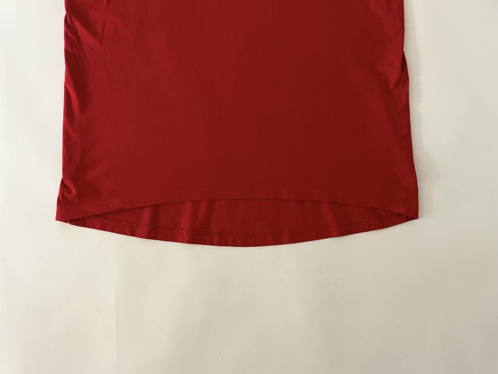 One-of-a-kind sustainable red heart cut-out t-shirt by Sarah Aphrodite. Size Large with curved front hem and straight back hem. Handmade from repurposed cotton.