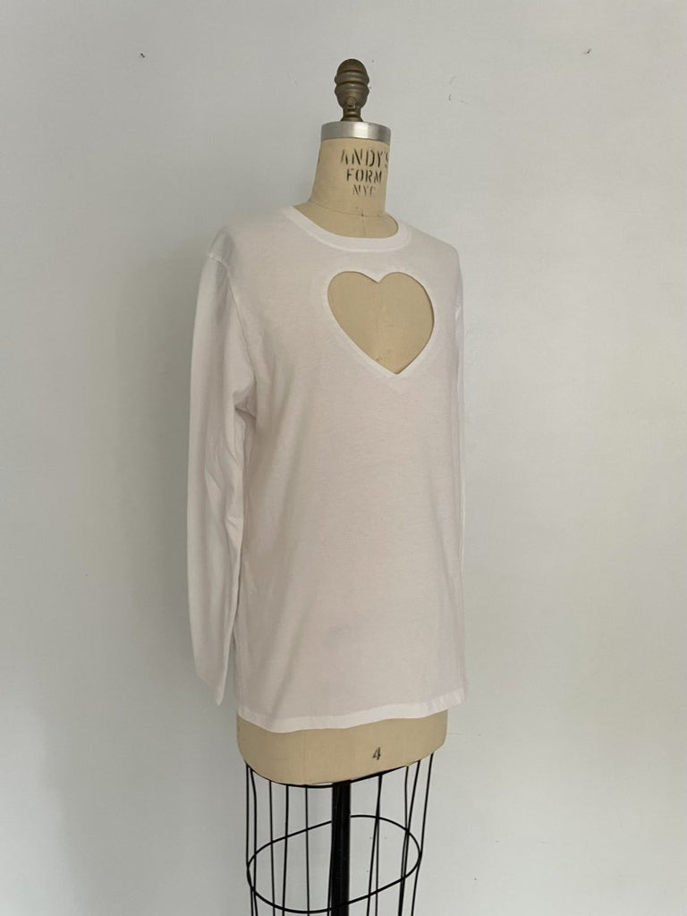 One-of-a-kind sustainable white long sleeve top by Sarah Aphrodite. Large heart cut-out on chest, handmade from repurposed cotton. Fits Medium.