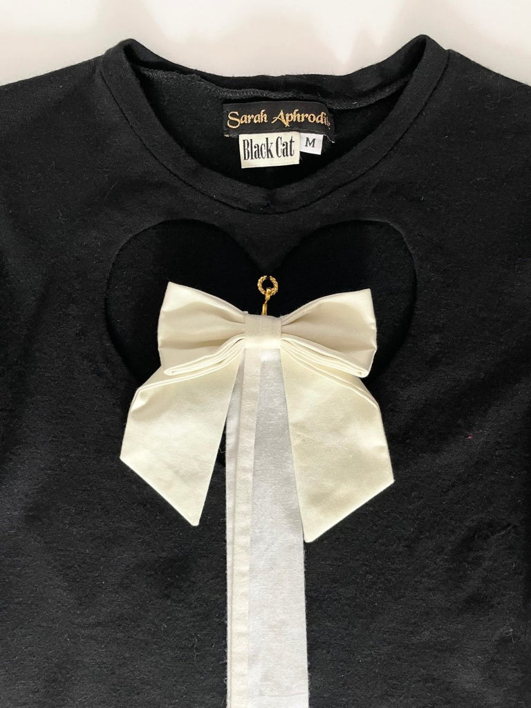 Handmade wool jersey long sleeve top with heart cut-out and detachable white bow by Sarah Aphrodite, size small, sustainable upcycled design