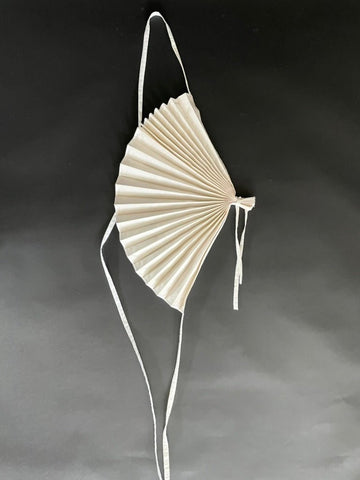 White handmade silk shantung fan accessory with polyester lining by Sarah Aphrodite, worn as an avant-garde shoulder decoration
