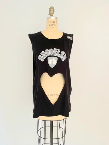 Front view of handmade one-of-a-kind belly heart cut-out tank with Brooklyn print displayed on a mannequin
