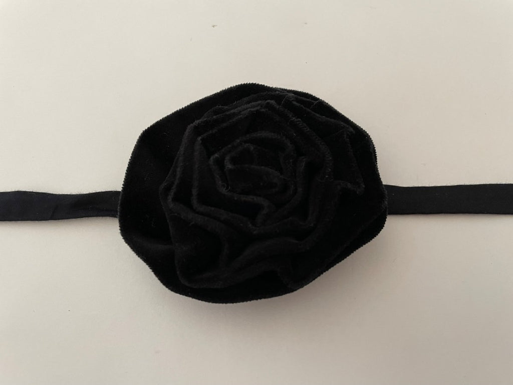 One-of-a-kind black velvet flower accessory by Sarah Aphrodite, handmade from upcycled fabric scraps. Versatile design with ties, worn as choker, bracelet, anklet, upper arm, or garment embellishment.