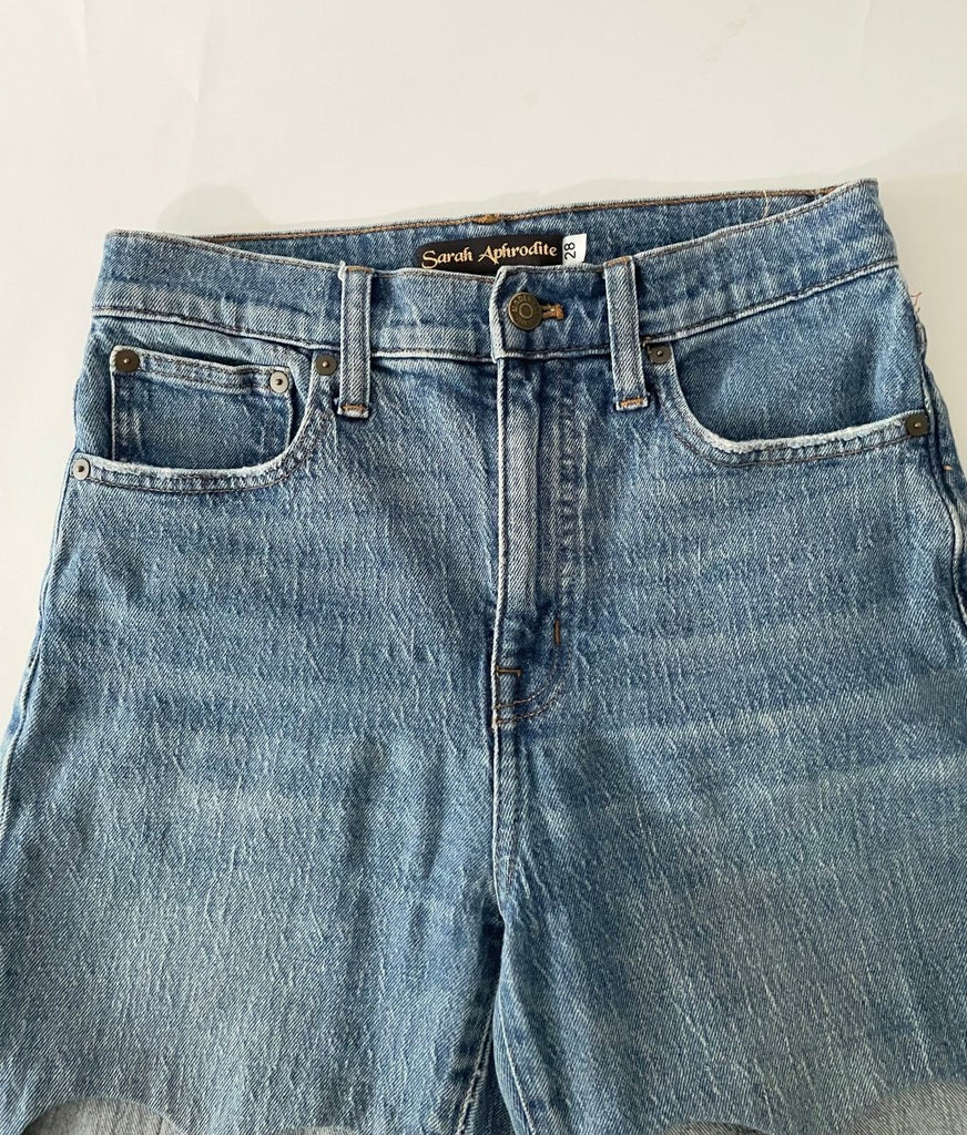 Blue jeans  close up front on a white background