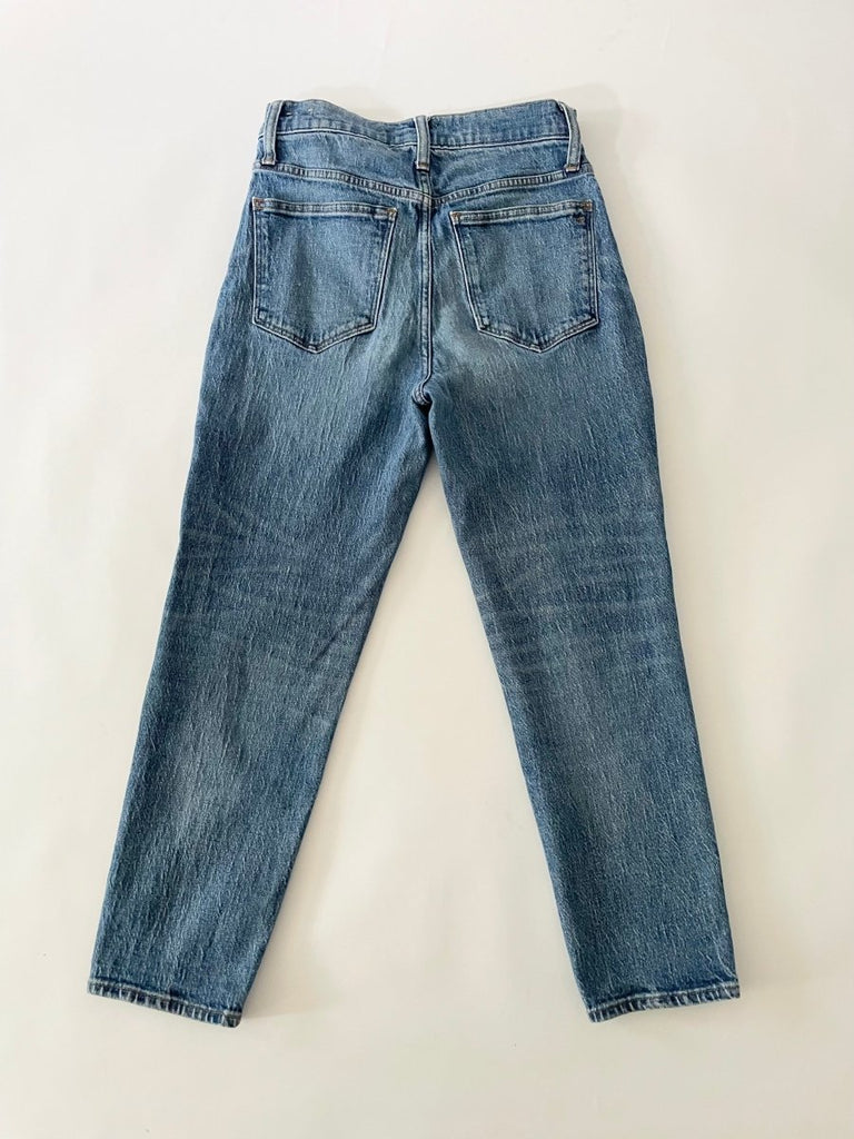 back of a Blue pair of jeans on a white background