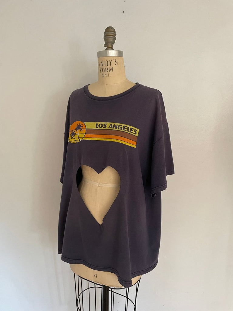 side view of handmade one-of-a-kind faded blue belly heart cut-out tee with Los Angeles print