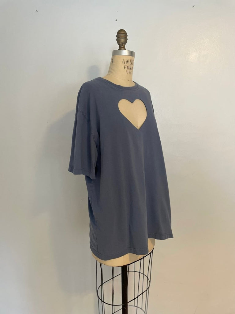 Side view of grey-blue cotton/poly blend t-shirt with heart cut-out on a mannequin