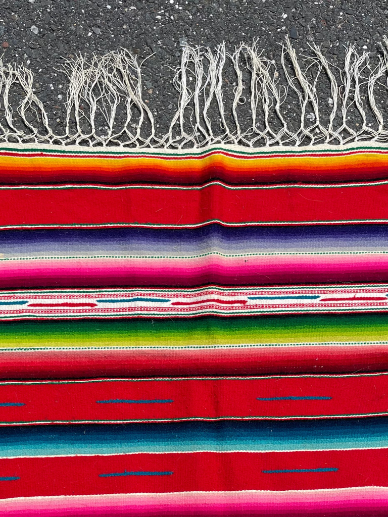 Colorful handwoven Mexican tapestry with bold traditional patterns and fringe, 46 x 117 cm
